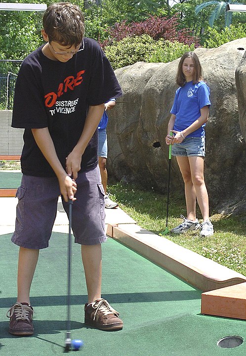 Boy playing in a Putt-Putt Golf Course
Wikimedia
Link: https://upload.wikimedia.org/wikipedia/commons/thumb/d/d5/USMC-02980.jpg/800px-USMC-02980.jpg